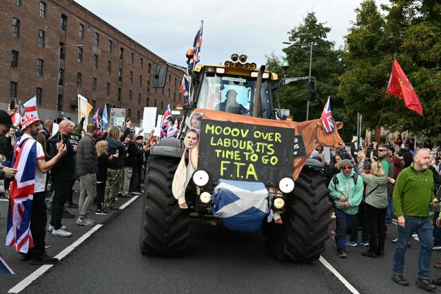 Demonstrators protest against the Labour Government's plans to introduce a Digital ID and farmer's inheritance tax policy, outside of the Labour Party's conference in Liverpool, north-west England, on September 28, 2025. (Photo by Oli SCARFF / AFP)
