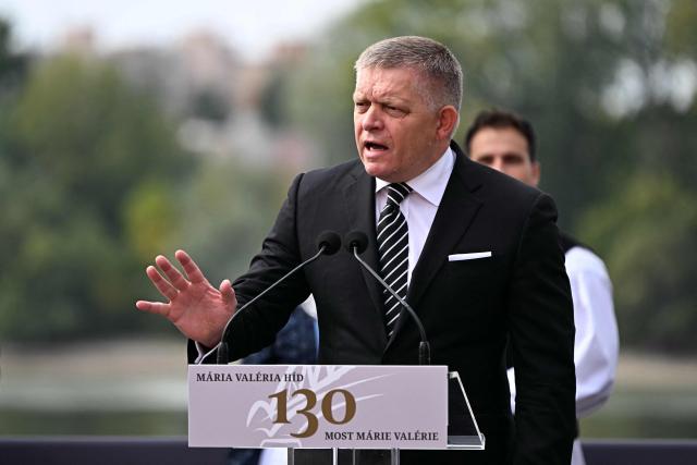 Slovak Prime Minister Robert Fico delivers a speech during a ceremony to celebrate the 130th anniversary of the Maria Valeria Bridge that connects the Slovak town of Sturovo with the Hungarian town of Esztergom, near the countries' common border in Esztergom, Hungary on September 28, 2025. The bridge links the two countries across the Danube river. It was opened on September 28, 1895. (Photo by Attila KISBENEDEK / AFP)