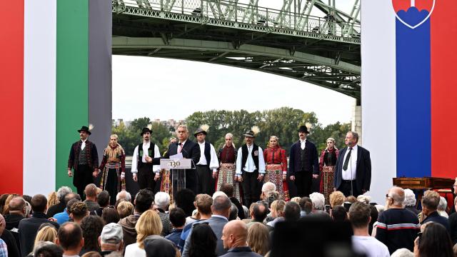 Hungarian Prime Minister Victor Orban addresses guests during a ceremony to celebrate the 130th anniversary of the Maria Valeria Bridge that connects the Slovak town of Sturovo with the Hungarian town of Esztergom, near the countries' common border in Esztergom, Hungary on September 28, 2025. The bridge links the two countries across the Danube river. It was opened on September 28, 1895. (Photo by Attila KISBENEDEK / AFP)