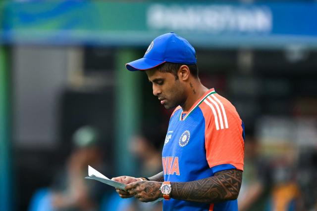 India's captain Suryakumar Yadav arrives on the field for the toss before the start of the Asia Cup 2025 Twenty20 international cricket final match between India and Pakistan at the Dubai International Stadium in Dubai on September 28, 2025. (Photo by Sajjad HUSSAIN / AFP)