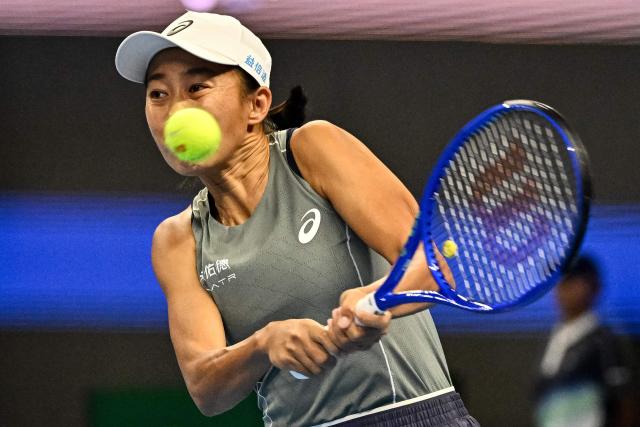China’s Zhang Shuai hits a return to the USA’s Amanda Anisimova during their women’s singles match at the China Open tennis tournament in Beijing on September 28, 2025. (Photo by Pedro Pardo / AFP)