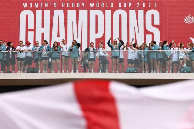 England players celebrate at a Red Roses Champions Party, held at Battersea Power Station in central London on September 28, 2025, after their win in the final of the Women’s Rugby World Cup against Canada the previous day. England coach insisted the Red Roses could "dominate the world for a long time" after their 33-13 win over Canada in the Women's Rugby World Cup final at Twickenham on Saturday. (Photo by HENRY NICHOLLS / AFP)