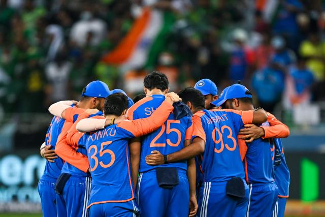India's players huddle before the start of the Asia Cup 2025 Twenty20 international cricket final match between India and Pakistan at the Dubai International Stadium in Dubai on September 28, 2025. (Photo by Sajjad HUSSAIN / AFP)
