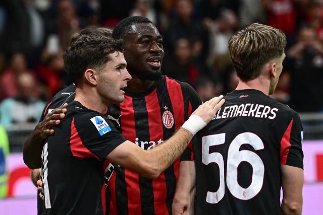 AC Milan's US forward #11 Christian Pulisic (L) celebrates with his teammates after scoring his team's second goal during the Italian Serie A football match between AC Milan and SSC Napoli at San Siro stadium in Milan, northern Italy, on September 28, 2025. (Photo by Piero CRUCIATTI / AFP)