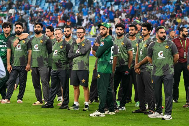 Pakistan's cricket team members wait for the presentation ceremony at the end of the Asia Cup 2025 Twenty20 international cricket final match between India and Pakistan at the Dubai International Stadium in Dubai on September 28, 2025. (Photo by Sajjad HUSSAIN / AFP)
