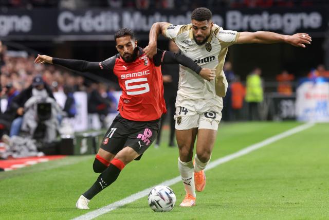 Rennes' Jordanian forward #11 Mousa Tamari (L) fights for the ball with Lens' French defender #14 Matthieu Udol during the French L1 football match between Stade Rennais FC and RC Lens at the Roazhon Park stadium in Rennes, western France, on September 28, 2025. (Photo by Fred TANNEAU / AFP)