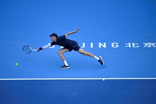 Italy's Jannik Sinner hits a return to Hungary Fabian Marozsan during their men's single quarter final match at the China Open tennis tournament in Beijing on September 29, 2025. (Photo by WANG Zhao / AFP)