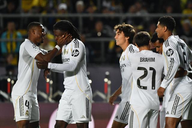 Real Madrid's French midfielder #06 Eduardo Camavinga (2nd L) celebrates scoring his team's fourth goal with his teammates during the UEFA Champions League first round day 2 football match between Kairat Almaty and Real Madrid at the Almaty Ortalyk stadion in Almaty on September 30, 2025. (Photo by Vyacheslav OSELEDKO / AFP)