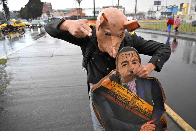 A demonstrator holds a life-size cardboard image of Ecuador's President Daniel Noboa as he takes part in an anti-government protest in support of the national strike called by CONAIE (Ecuador's largest indigenous organization) in Quito on September 30, 2025. Ecuador's largest Indigenous rights organization, Conaie, said Efrain Fuerez was shot three times by soldiers during demonstrations on September 28, 2025, and held President Daniel Noboa responsible for his death. (Photo by Rodrigo BUENDIA / AFP)