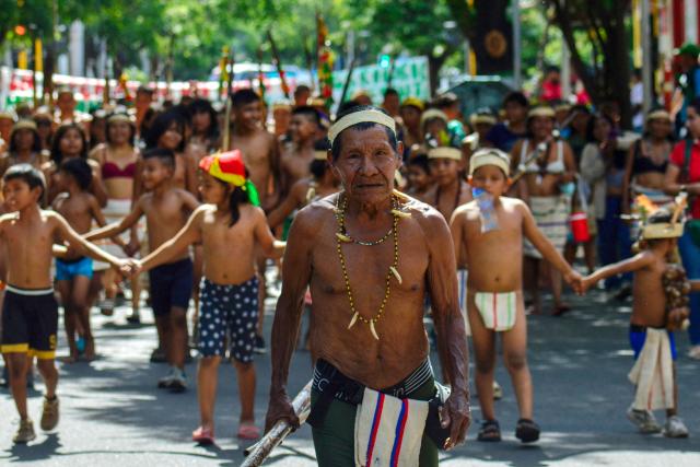 A Motilon-Bari indigenous man looks on as he marches during a protest against Colombia's President Gustavo Petro's government in Cucuta, North Santander Department, Colombia on September 30, 2025. Protesters demanded that authorities protect their territory that's threatened by armed groups, deforestation, and mining, among other issues. (Photo by Schneyder MENDOZA / AFP)