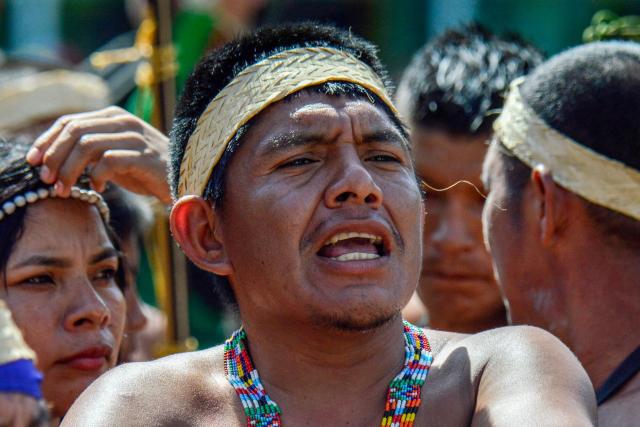 A Motilon-Bari indigenous man shouts slogans as he marches during a protest against Colombia's President Gustavo Petro's government in Cucuta, North Santander Department, Colombia on September 30, 2025. Protesters demanded that authorities protect their territory that's threatened by armed groups, deforestation, and mining, among other issues. (Photo by Schneyder MENDOZA / AFP)