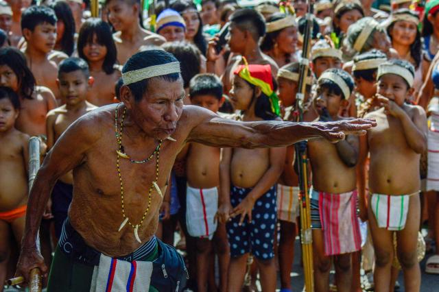 A Motilon-Bari indigenous man gestures as he marches during a protest against Colombia's President Gustavo Petro's government in Cucuta, North Santander Department, Colombia on September 30, 2025. Protesters demanded that authorities protect their territory that's threatened by armed groups, deforestation, and mining, among other issues. (Photo by Schneyder MENDOZA / AFP)