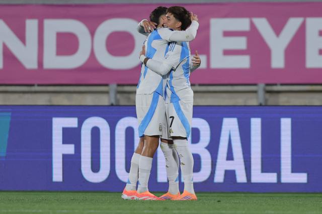 Argentina's midfielder #15 Tomas Perez (L) celebrates scoring his team's second goal with forward #07 Maher Carrizo during the 2025 FIFA U-20 World Cup football match between Argentina and Australia at the Elias Figueroa Stadium in Valparaiso, Chile on October 1, 2025. (Photo by Javier TORRES / AFP)