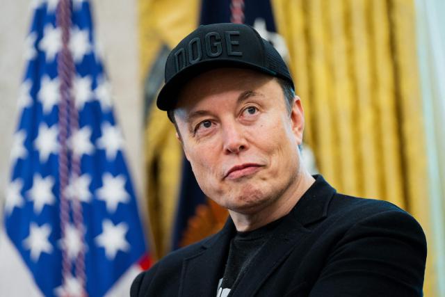 (FILES) Elon Musk looks on during a news conference with US President Donald Trump in the Oval Office of the White House in Washington, DC, on May 30, 2025. Billionaire Elon Musk, the world's richest person, is nearly halfway to becoming the planet's first trillionaire, Forbes magazine reported on October 1, 2025. (Photo by Allison ROBBERT / AFP)
