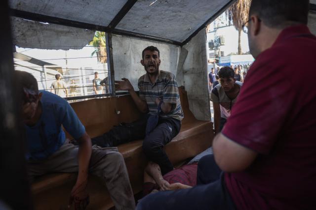 Palestinians transport casualties of a reported Israeli drone attack in Deir al-Balah, to Al-Aqsa Martyrs Hospital in the central Gaza Strip on October 2, 2025. Israel's defence minister issued a final warning for residents in Gaza City to flee south on October 1, as the Palestinian Hamas movement weighed the latest US plan to end the war in the besieged Palestinian territory. (Photo by BASHAR TALEB / AFP)