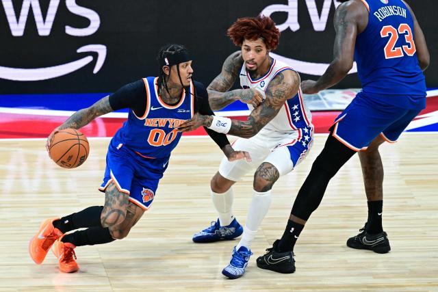 New York Knicks' #00 Jordan Clarkson dribbles the ball past Philadelphia 76ers' #09 Kelly Oubre Jr. during the NBA basketball game between the New York Knicks and the Philadelphia 76ers at the Etihad Arena in Abu Dhabi on October 2, 2025. (Photo by Giuseppe CACACE / AFP)