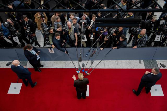 Denmark's Prime Minister Mette Frederiksen (C) gives interviews as she arrives to attend the 7th European Political Community (EPC) Summit at the Bella Center in Copenhagen on October 2, 2025. (Photo by Mads Claus Rasmussen / Ritzau Scanpix / AFP) / Denmark OUT