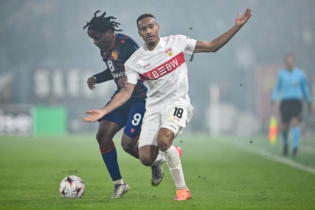 Basel's Swedish forward #09 Jeremy Agbonifo and VfB Stuttgart's German forward #18 Jamie Leweling fight for the ball during the UEFA Europa League first round day 2 football match between Basel and Stuttgart at St. Jakob-Park stadium in Basel on October 2, 2025. (Photo by Fabrice COFFRINI / AFP)