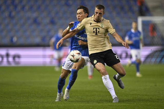 RC Genk's South Korean forward #09 Hyeongyu Oh (L) fights for the ball with Ferencvaros' Belgian defender #28 Toon Raemaekers (R) during the UEFA Europa League first round day 2 football match between KRC Genk and Ferencvaros at The Cegeka Arena in Genk on October 2, 2025. (Photo by Johan Eyckens / BELGA / AFP) / Belgium OUT