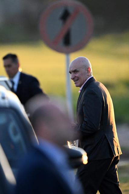 Argentina's deputy Jose Luis Espert leaves after the official presentation of a comprehensive reform bill for the Penal Code at Federal Penitentiary Complex No. 1 in Ezeiza, Buenos Aires province, on October 2, 2025. (Photo by Luis ROBAYO / AFP)