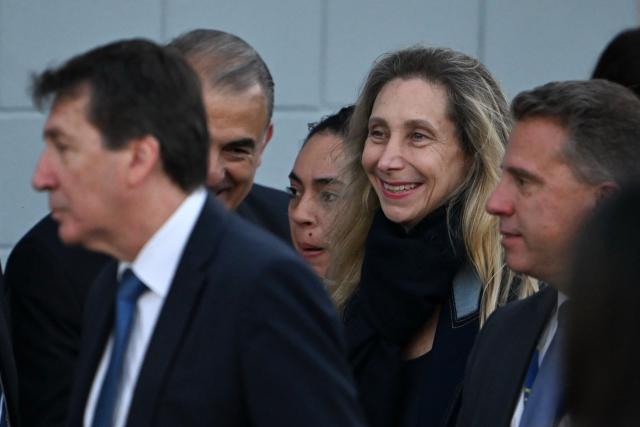 Argentina's Secretary General of the Presidency Karina Milei (2nd R) leaves after the official presentation of a comprehensive reform bill for the Penal Code at Federal Penitentiary Complex No. 1 in Ezeiza, Buenos Aires province, on October 2, 2025. (Photo by Luis ROBAYO / AFP)