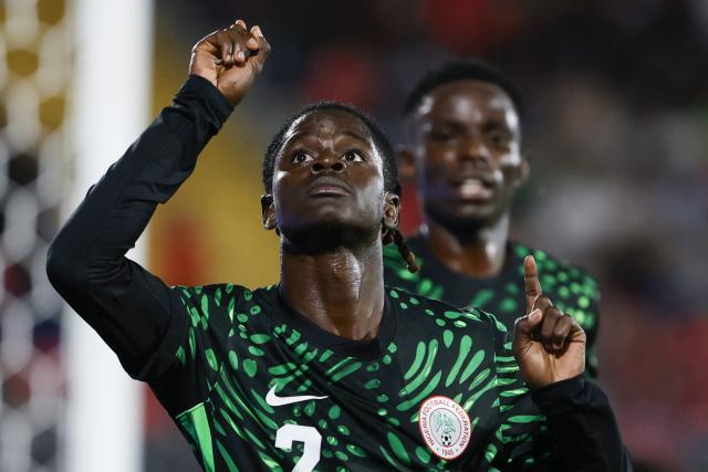 Nigeria's defender #2 Amos Ochoche celebrates scoring his team's second goal during the 2025 FIFA U-20 World Cup football match between Nigeria and Saudi Arabia at the Fiscal Stadium in Talca, Chile on October 2, 2025. (Photo by Raul BRAVO / AFP)