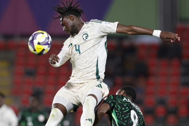 Saudi Arabia's defender #4 Saud Harun jumps for the ball during the 2025 FIFA U-20 World Cup football match between Nigeria and Saudi Arabia at the Fiscal Stadium in Talca, Chile on October 2, 2025. (Photo by Raul BRAVO / AFP)