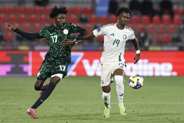 Nigeria's midfielder #17 Tahir Maigana and Saudi Arabia's defender #19 Awad Aman fight for the ball during the 2025 FIFA U-20 World Cup football match between Nigeria and Saudi Arabia at the Fiscal Stadium in Talca, Chile on October 2, 2025. (Photo by Raul BRAVO / AFP)