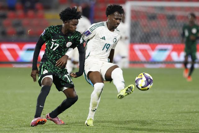 Nigeria's midfielder #17 Tahir Maigana and Saudi Arabia's defender #19 Awad Aman fight for the ball during the 2025 FIFA U-20 World Cup football match between Nigeria and Saudi Arabia at the Fiscal Stadium in Talca, Chile on October 2, 2025. (Photo by Raul BRAVO / AFP)