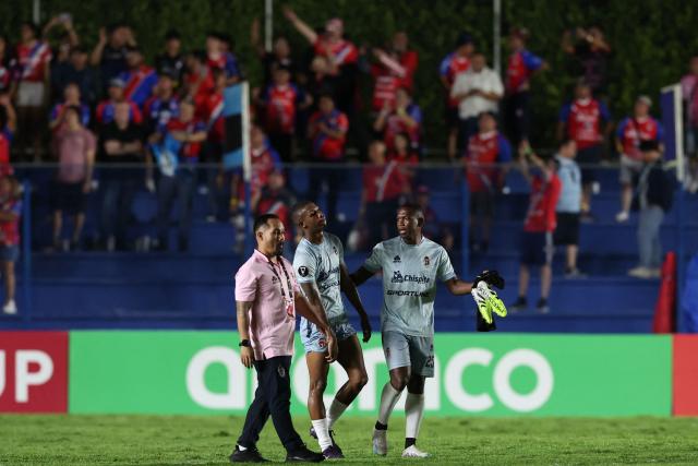 Players of Sporting San Miguelito react after losing the CONCACAF Central American Cup quarter-final second leg football match between Panama's Sporting San Miguelito and Guatemala's Xelaju at the Estadio Universitario in Penonome, Panama on October 2, 2025. (Photo by MARTIN BERNETTI / AFP)