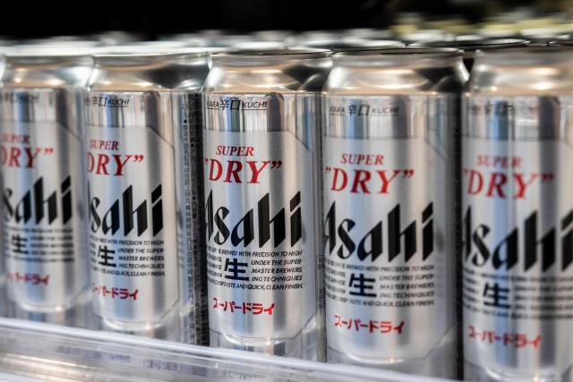 Asahi Super Dry beers are seen on display at a supermarket in Tokyo on October 3, 2025. Asahi Group Holdings, a major beer company, announced that it had experienced a system failure due to a cyber attack. (Photo by Yuichi YAMAZAKI / AFP)