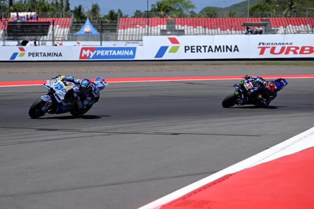 BK8 Gresini Racing MotoGP team's Spanish MotoGP rider Alex Marquez (L) and Monster Energy Yamaha MotoGP team's Spanish MotoGP rider Alex Rins ride during the free practice ahead of the MotoGP Indonesian Grand Prix at the Mandalika International Circuit in Mandalika, West Nusa Tenggara on October 3, 2025. (Photo by SONNY TUMBELAKA / AFP)