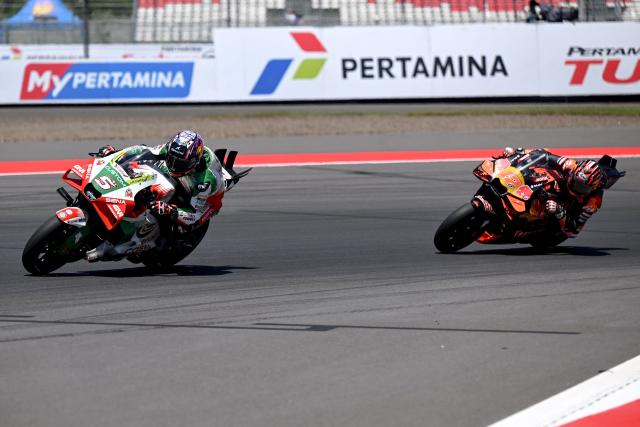 LRC Honda team's French MotoGP rider Johann Zarco (L) and Red Bull KTM Tech3 team's  Spanish MotoGP rider Maverick Vinales ride during the free practice ahead of the MotoGP Indonesian Grand Prix at the Mandalika International Circuit in Mandalika, West Nusa Tenggara on October 3, 2025. (Photo by SONNY TUMBELAKA / AFP)