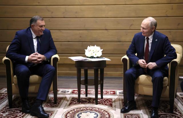 In this pool photograph distributed by the Russian state agency Sputnik, Russia's President Vladimir Putin meets with Bosnian Serb leader Milorad Dodik in Sochi on October 2, 2025. (Photo by Mikhail METZEL / POOL / AFP)