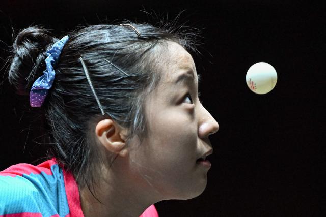 South Korea’s Shin Yu-bin serves to South Korea’s Joo Cheon-hui during their women’s singles quarterfinal match at the China Smash table tennis tournament in Beijing on October 3, 2025. (Photo by ADEK BERRY / AFP)
