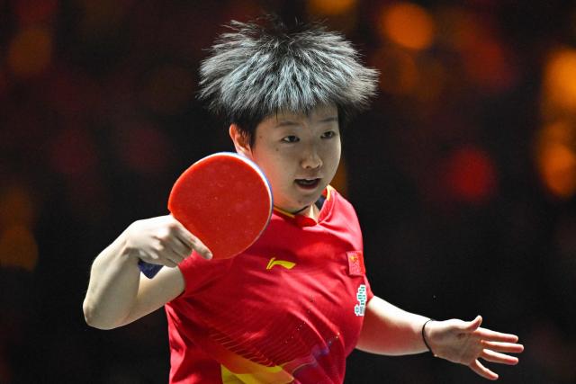 China’s Sun Yingsha hits a return to China’s Wang Yidi during their women’s singles quarterfinal match at the China Smash table tennis tournament in Beijing on October 3, 2025. (Photo by ADEK BERRY / AFP)