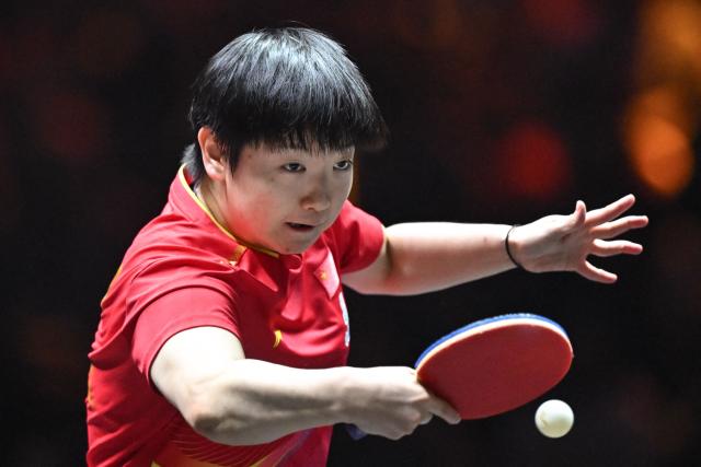 China’s Sun Yingsha hits a return to China’s Wang Yidi during their women’s singles quarterfinal match at the China Smash table tennis tournament in Beijing on October 3, 2025. (Photo by ADEK BERRY / AFP)