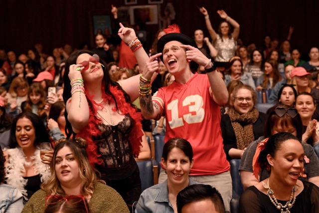 Taylor Swift fans dance during a listening event of Swift's new album 'The Life of a Showgirl' at the Astor Theatre in Melbourne on October 3, 2025. Swift on October 3 dropped her 12th studio album, "The Life of a Showgirl," a collection of bouncy pop songs about love, marriage, success -- and score-settling. For the hotly anticipated album, the 35-year-old artist reunited with Swedish hitmakers Max Martin and Shellback, and their influence is clear in the driving beats and catchy hooks. (Photo by William WEST / AFP)