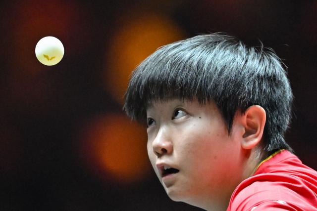 China’s Sun Yingsha serves to China’s Wang Yidi during their women’s singles quarterfinal match at the China Smash table tennis tournament in Beijing on October 3, 2025. (Photo by ADEK BERRY / AFP)