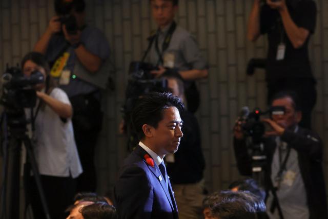 Shinjiro Koizumi, Japan's Agriculture Minister and Prime Minister contender, reacts after delivering a speech at the Liberal Democratic Party's (LDP) leadership election in Tokyo on October 4, 2025. (Photo by Kim Kyung-Hoon / POOL / AFP)
