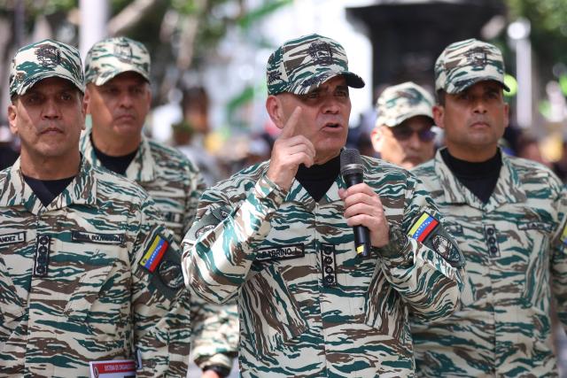 Venezuela's Defense Minister Vladimir Padrino Lopez speaks during a training session of the Bolivarian National Militia in Caracas on October 4, 2025. Venezuelan soldiers carried out communication drills on Saturday in preparation for a possible armed conflict, in response to what they denounce as a “siege” by the US. (Photo by Pedro MATTEY / AFP)