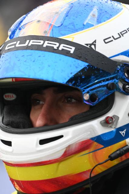 Spanish Youtuber "Karchez" looks on prior to a sprint race, part of the F4 GP Explorer car race, at the Bugatti circuit in Le Mans, western France, on October 4, 2025. The three-day event brought together 200,000 spectators and some of the biggest names in French rap. (Photo by JEAN-FRANCOIS MONIER / AFP)
