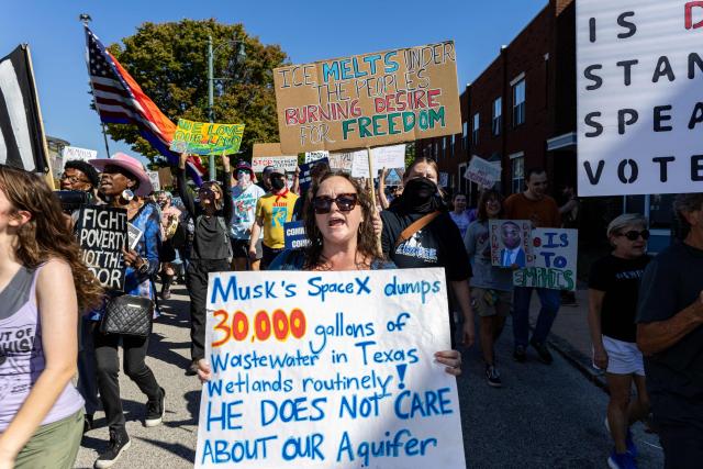 Protesters march through downtown Memphis, Tennessee, in opposition to the increase of federal law enforcement agents, the coming deployment of the National Guard and xAI, an AI company owned by Elon Musk that is locally based, during the "Get Out of Memphis" protest on October 4, 2025. Over the past week the city of Memphis has seen a dramatic increase in federal law enforcement as the Trump administration pledges to fight crime in the city. The protest was organized by Tigers Against Pollution, a student led activist group based in Memphis. (Photo by Austin Johnson / AFP)