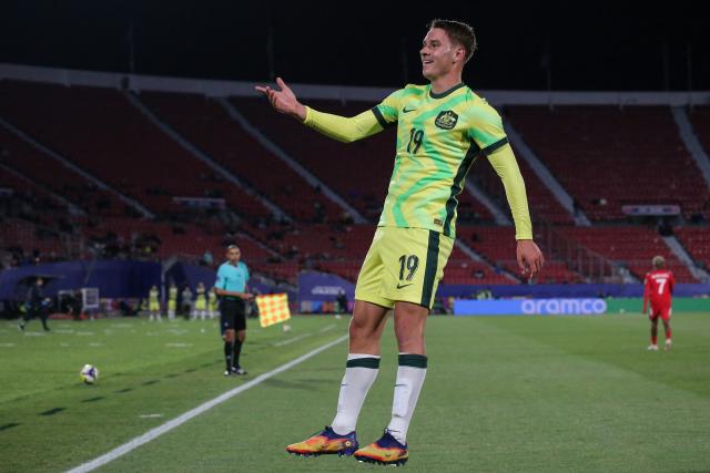 Australia's forward #19 Max Caputo celebrates scoring his team's first goal during the 2025 FIFA U-20 World Cup football match between Australia and Cuba at the National Stadium in Santiago on October 4, 2025. (Photo by JAVIER TORRES / AFP)