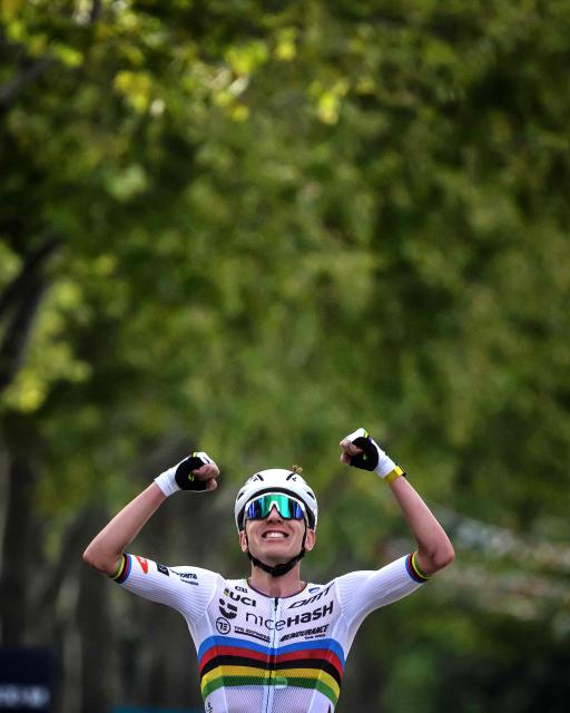 Slovenian rider Tadej Pogacar celebrates as he wins the men's Elite Road Race at the European Cycling Championship 2025 near Valence, southeastern France on October 5, 2025. (Photo by JEFF PACHOUD / AFP)