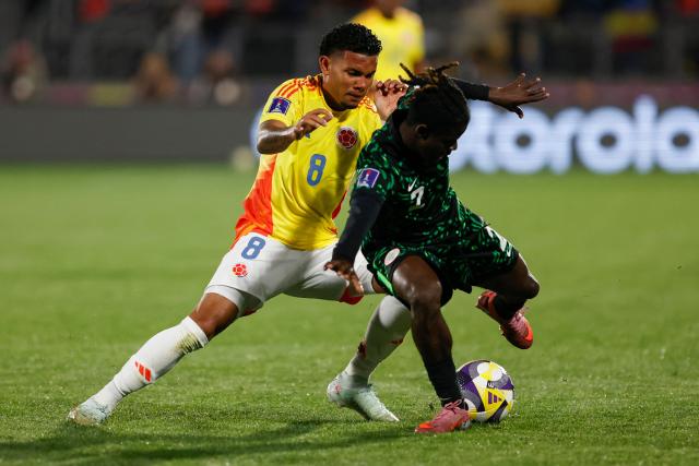 Colombia's midfielder #08 Royner Benitez and Nigeria's defender #2 Amos Ochoche fight for the ball during the 2025 FIFA U-20 World Cup football match between Nigeria and Colombia, at the Fiscal stadium in Talca, Chile, on October 5, 2025. (Photo by Raul BRAVO / AFP)