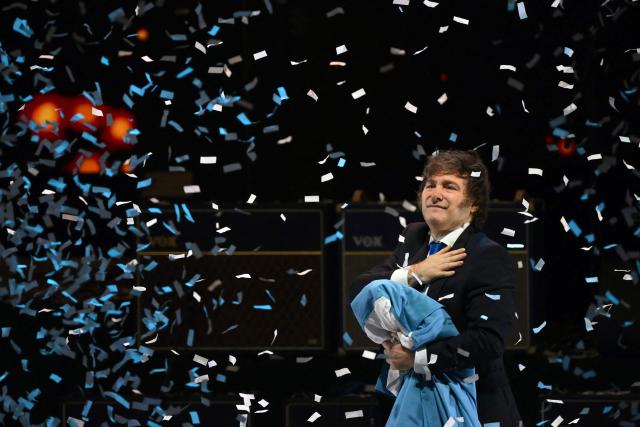 Argentina's President Javier Milei gestures during the launch of his new book, "The Making of the Miracle," at the Movistar Arena in Buenos Aires on October 6, 2025. (Photo by Luis ROBAYO / AFP)