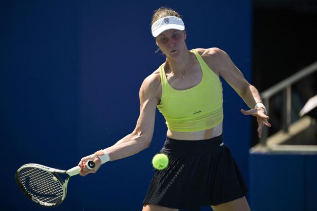 Russia's Liudmila Samsonova hits a return to Colombia's Emiliana Arango during their women's singles match at the Wuhan Open tennis tournament in Wuhan, Central China's Hubei province on October 7, 2025. (Photo by Adek BERRY / AFP)