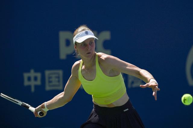 Russia's Liudmila Samsonova hits a return to Colombia's Emiliana Arango during their women's singles match at the Wuhan Open tennis tournament in Wuhan, Central China's Hubei province on October 7, 2025. (Photo by Adek BERRY / AFP)