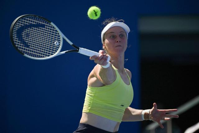 Russia's Liudmila Samsonova hits a return to Colombia's Emiliana Arango during their women's singles match at the Wuhan Open tennis tournament in Wuhan, Central China's Hubei province on October 7, 2025. (Photo by Adek BERRY / AFP)